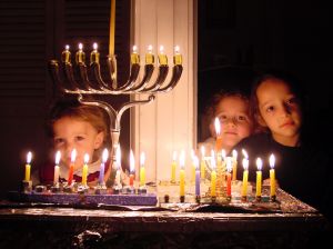 kids-behind-chanukah-menorah-414244-m.jpg