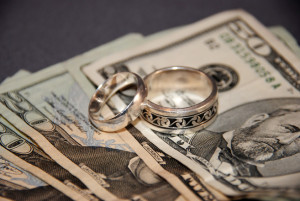 wedding-rings-and-money-1307450-300x201