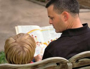 daddy-reading-behind-1432160-300x231